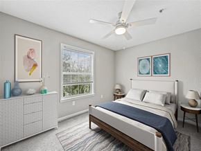 Orlando apartment for rent - a bedroom with a bed and a ceiling fan