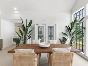 Tampa apartment for rent - A dining room with a wooden table and chairs.