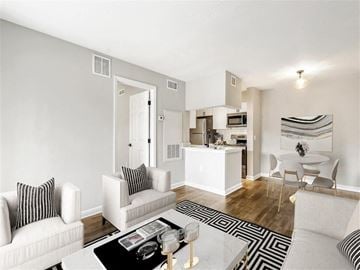 Tampa apartment for rent - A living room with a white couch and a coffee table.