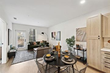 Atlanta apartment for rent - a living room and dining room with a table and chairs