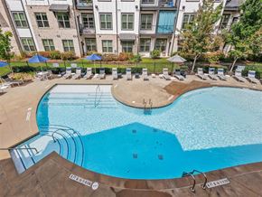 Woodstock apartment for rent - a large swimming pool in front of an apartment building