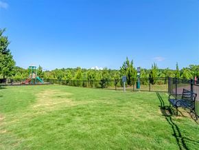 Woodstock apartment for rent - a large yard with a playground and a bench