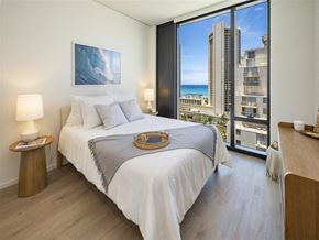 Honolulu apartment for rent - a bedroom with a bed and a view of the ocean