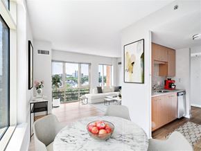 Cambridge apartment for rent - an open kitchen and living room with a marble table
