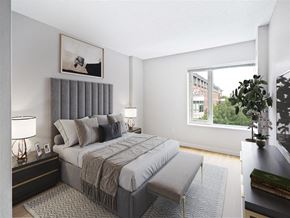 Cambridge apartment for rent - a bedroom with a large bed and a window