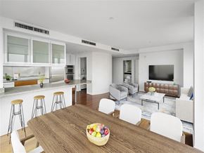 Cambridge apartment for rent - A modern kitchen with a wooden table and white chairs.