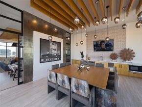 Baltimore apartment for rent - A modern dining room with a wooden table and chairs.