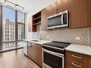 Silver Spring apartment for rent - a kitchen with a stove and a microwave