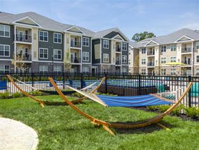 Mt Laurel Township apartment for rent - a group of hammocks in front of an apartment building