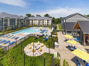 Mt Laurel Township apartment for rent - an aerial view of an outdoor pool with lounge chairs and umbrellas