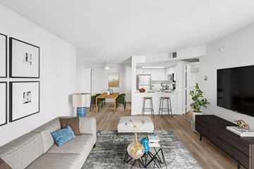 Glendale apartment for rent - A living room with a grey couch and a grey rug.
