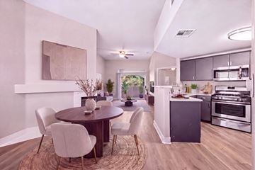 Las Vegas apartment for rent - A modern kitchen with a dining table and chairs.