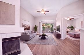 Las Vegas apartment for rent - A modern living room with a fireplace and a large window.