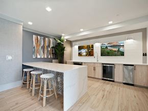 Wilmington apartment for rent - a kitchen with a marble counter top and bar stools