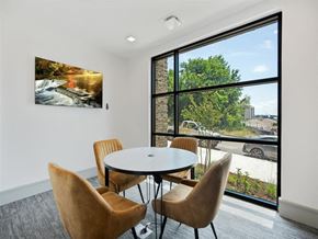 Wilmington apartment for rent - a dining room with a large window and a table with chairs