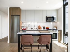 Bronx apartment for rent - a kitchen with a counter and two chairs