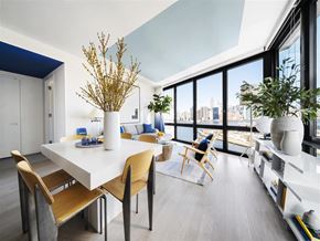 Brooklyn apartment for rent - a dining room with a white table and chairs and a large window