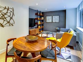 New York apartment for rent - a living room with a table and chairs