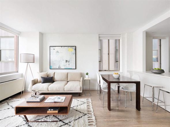 New York apartment for rent - a living room and dining room with a couch and a table