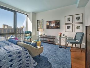 New York apartment for rent - A bedroom with a large bed and a chair.