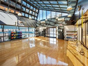 New York apartment for rent - An exercise studio with wooden floors and a glass ceiling.