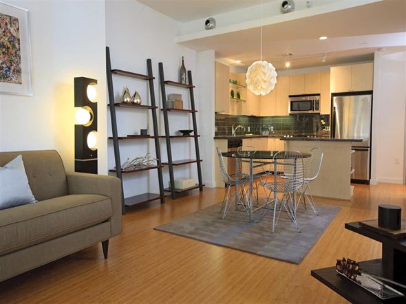 Dallas apartment for rent - a living room and kitchen with a table and chairs