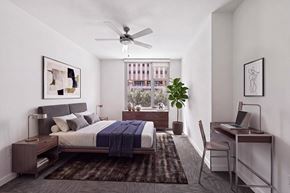 Dallas apartment for rent - A bedroom with a bed, desk, and chair.