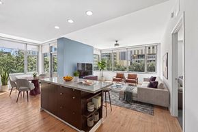 Dallas apartment for rent - A modern kitchen with a dining table and chairs.