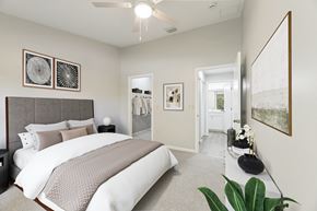 West Palm Beach apartment for rent - A bedroom with a large bed and a ceiling fan.