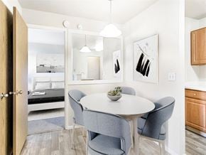 Murray apartment for rent - a dining room with a white table and chairs