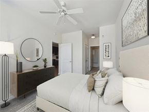 Alexandria apartment for rent - a white bedroom with a large bed and a ceiling fan