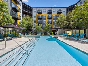 Alexandria apartment for rent - A swimming pool in front of apartment buildings.