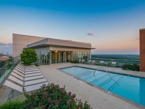 Mclean apartment for rent - a swimming pool with a building in the background