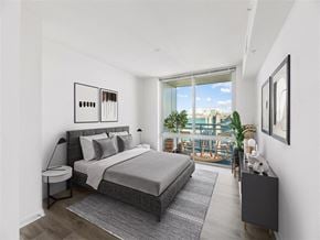 Mclean apartment for rent - a bedroom with a bed and a large window
