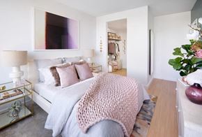 Jersey City apartment for rent - a bedroom with a white bed and a pink blanket