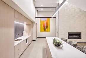 Jersey City apartment for rent - a kitchen with a long counter top and a fireplace
