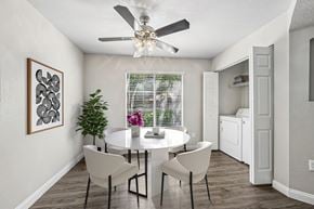 Las Vegas apartment for rent - A dining room with a white table and chairs.