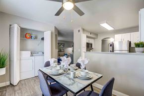 Las Vegas apartment for rent - a dining room table and a kitchen with a ceiling fan