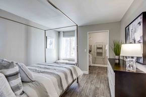 Las Vegas apartment for rent - a bedroom with a large bed and a mirror