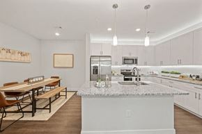 Charlotte apartment for rent - a kitchen with an island and a dining table