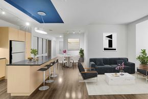 Dallas apartment for rent - A modern kitchen with a bar and a dining area.