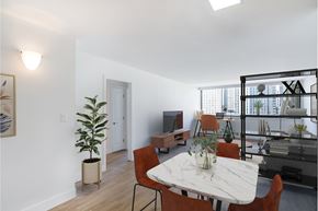 Boston apartment for rent - A dining room with a white table and chairs.