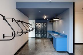 Beaverton apartment for rent - a tasting room with a blue counter and a metal spiral staircase