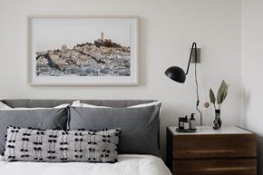 Beaverton apartment for rent - a bedroom with a bed with a pillow and a picture on the wall