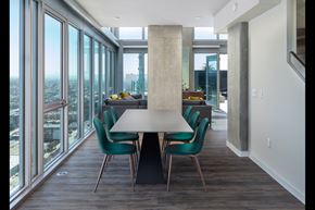 San Diego apartment for rent - A modern dining room with a large table and chairs.