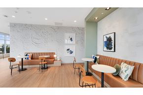 Seattle apartment for rent - a seating area with couches and tables