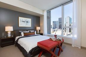 Seattle apartment for rent - a bedroom with a bed and a large window
