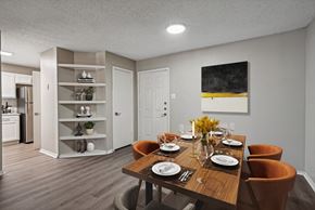 Irving apartment for rent - a dining room with a wooden table and chairs