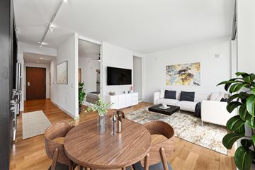 Washington apartment for rent - A modern living room with a wooden table and chairs.