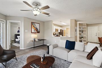 Irving apartment for rent - A living room with a white couch and a brown coffee table.
